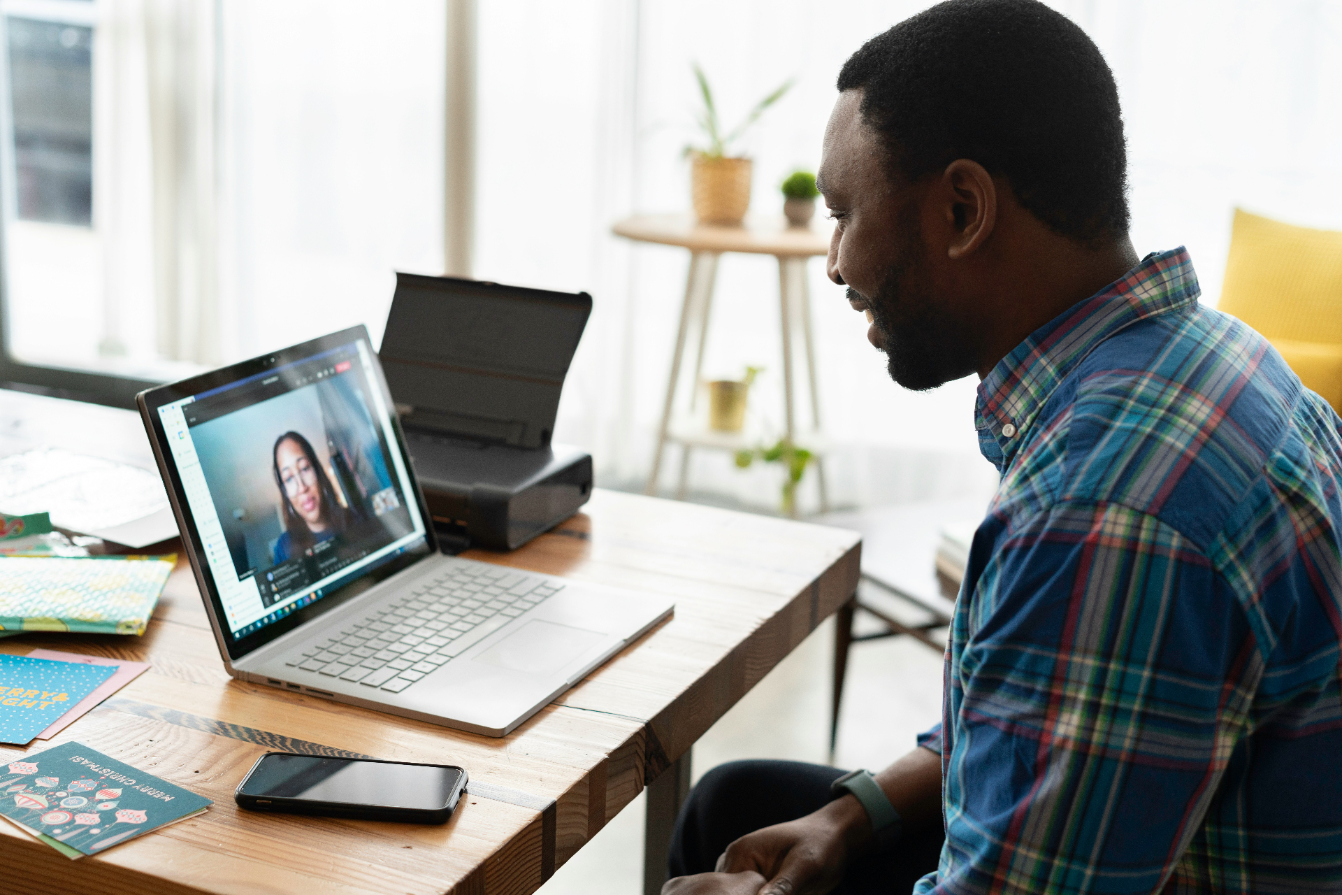 Homeowner on a video call with a handyman for remote assistance